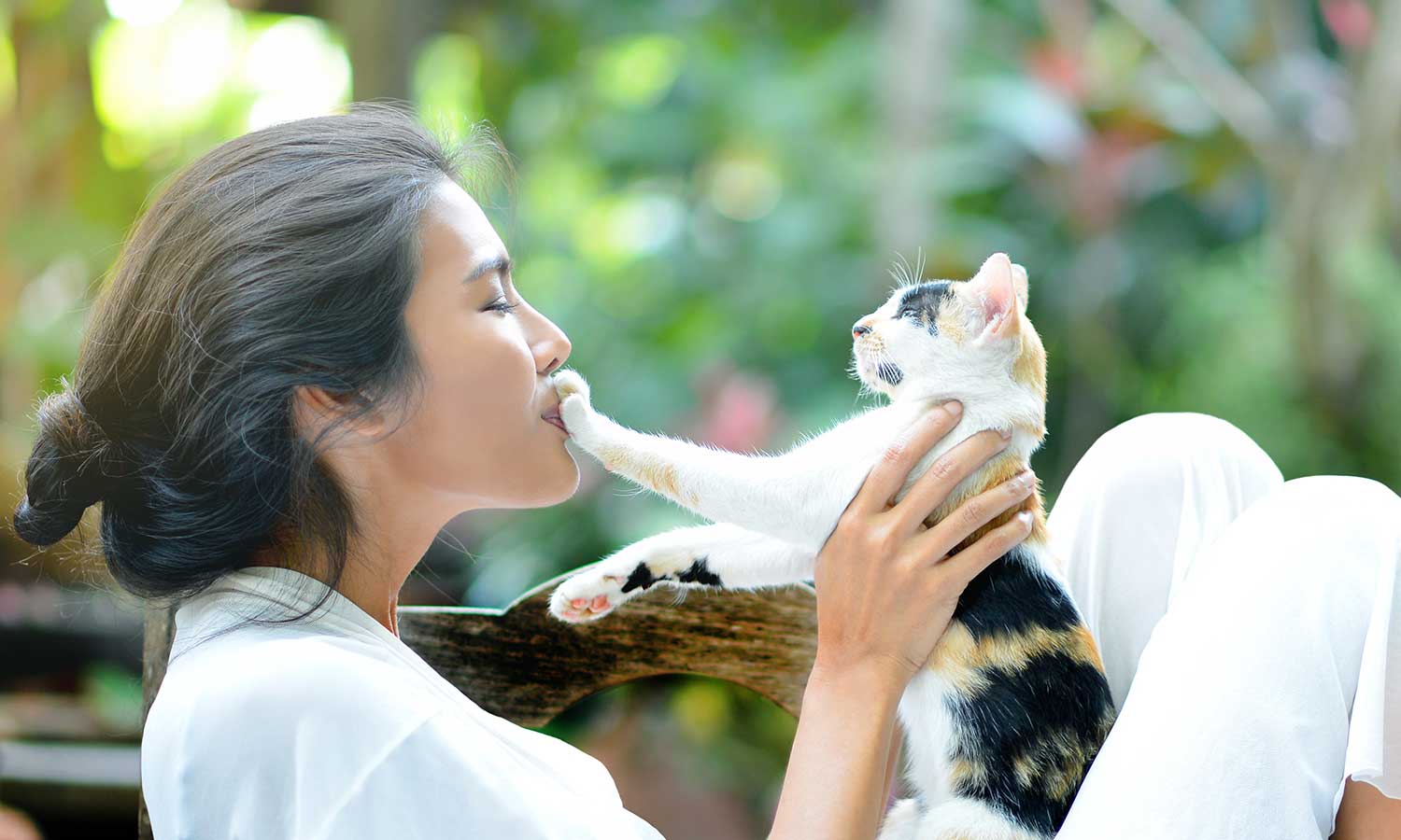 A woman holding her cat